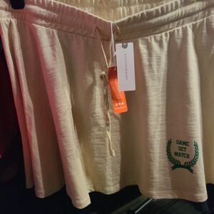 Anthropologie Cream Circle Skater Skirt with 'Game Set Match' Embroidery